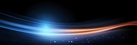 Glowing blue and orange light trails with sparkles on dark background create dynamic motion effect for technology and energy concepts.