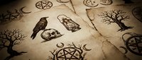 Mystical occult symbols and esoteric elements on aged parchment paper creating atmospheric witchcraft and magic themed background for spiritual designs.
