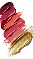 Colorful lipstick and golden eyeshadow smears isolated on white background for cosmetic beauty and makeup design projects.