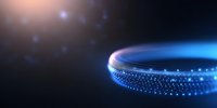 Glowing blue ring with sparkling particles floating in dark space creates magical atmosphere. Abstract circular light trail with bokeh effect and lens flare.