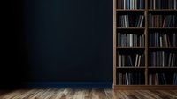 Dark room interior with wooden bookshelf against navy blue wall and hardwood flooring, creating moody atmospheric space for study, reading or education setting.