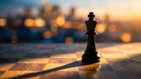 Black chess king piece standing on wooden surface with warm golden sunset bokeh lights creating strategic leadership and victory concept for business success.