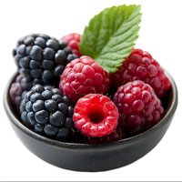 Fresh ripe raspberries and blackberries with green leaf in black ceramic bowl on white background, macro shot of mixed berries for healthy eating concept.