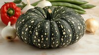 Fresh dark green speckled pumpkin with red bell pepper, garlic bulbs and green beans arranged on light surface, natural food composition for cooking.