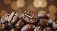 Fresh roasted coffee beans macro shot with golden bokeh lights in background, aromatic dark brown beans with rich texture and natural shine.