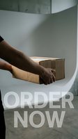 Male hands holding a cardboard parcel with Order Now text overlay, delivery and e-commerce concept for social media stories and ads.