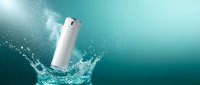 White cosmetic bottle splashing into turquoise water with dynamic droplets and bubbles for skincare and beauty product advertising campaigns.