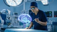 Asian male surgeon examining holographic brain model in modern operating room with advanced medical technology and surgical lights.