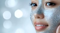 Young woman with silver glitter makeup on face and body creating sparkly cosmetic look for beauty skincare and fashion concepts.