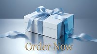 Elegant white gift box with blue ribbon and Order Now text on reflective surface, perfect for holiday promotions and online shopping campaigns.