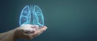 Human hands holding glowing blue lungs hologram on dark background representing respiratory health, medical care and pulmonary system protection concept.