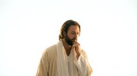 Thoughtful Middle Eastern man with beard in traditional white robe contemplating against clean background for spiritual and cultural content.