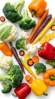 Fresh colorful vegetables isolated on white background including broccoli, bell peppers, carrots, cauliflower for healthy cooking and nutrition.