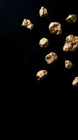 Golden brown rocks scattered on black background creating dramatic contrast for modern design projects and creative layouts.