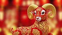 Golden ram with ornate patterns and curved horns on red bokeh background for Chinese New Year celebrations and zodiac decorations.