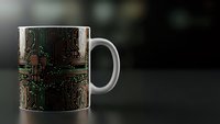 White ceramic mug with green circuit board pattern design on dark background. Technology themed drinkware for office or tech enthusiasts.