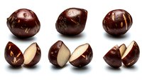 Fresh raw chestnuts, whole and cut in half showing creamy white flesh inside dark brown shell, arranged in rows on white background for food photography.