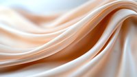 Smooth flowing waves of beige and white silk fabric create elegant abstract curves and lines against soft gradient background, suitable for luxury design projects.