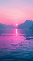 Tranquil sunset over mountain lake with pink and purple sky reflecting on rippling water surface, creating serene atmosphere for nature and wellness designs.