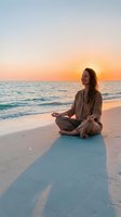 Young woman practicing yoga meditation on beach at golden sunset with ocean waves and peaceful atmosphere for wellness and mindfulness retreat.