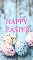 Festive speckled Easter eggs in pastel pink and blue with bright pink holiday text on rustic wooden background. Seasonal spring celebration greeting card design.