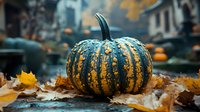 Striped green pumpkin with autumn leaves on urban street during fall season, perfect for seasonal decorations and harvest celebrations.