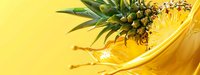 Fresh pineapple half submerged in golden juice splash against bright yellow background, tropical fruit beverage concept for food and drink design projects.