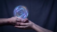 Glowing energy sphere floating above cupped hands showing collaboration and teamwork in dark atmospheric setting for business concepts.