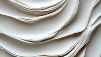 Elegant white fabric waves creating soft flowing curves and gentle folds in minimalist abstract composition, light and shadow play on textile surface.