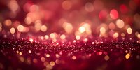 Red and gold glowing bokeh lights on dark background with sparkle effect, creating magical festive atmosphere for holiday designs and celebrations.