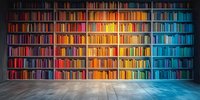 Colorful rainbow bookshelf arrangement in modern library interior with concrete floor and dramatic lighting creates vibrant spectrum display of book spines.