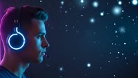Young man with headphones listening to music against starry night sky background with neon lighting effects for entertainment and technology concepts.