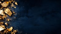 Shimmering gold nuggets and dust scattered on dark blue textured background with copy space, creating luxurious contrast for jewelry or financial concepts.