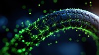 Glowing green particles flowing in curved motion against dark background create dynamic light trail effect for technology and science concepts.