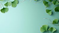 Fresh green ginkgo biloba leaves scattered on mint background creating natural frame with copy space. Wellness and alternative medicine concept.
