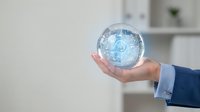 Businessperson holding transparent globe sphere with digital world map, representing global connectivity, international business, and worldwide network communication solutions.