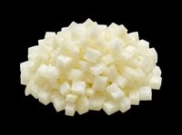 Pile of diced white onion cubes isolated on transparent background, ready for food clipart, recipe cards, menu design, stickers, and print on demand projects.