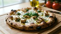 Neapolitan pizza with roasted vegetables, mozzarella, and fresh basil on wooden board in bright kitchen setting. Food photography.