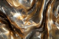 Luxurious golden bronze metallic fabric with flowing waves and shimmering surface texture for premium design projects and elegant backgrounds.