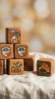 Wooden blocks with insurance and financial protection symbols including umbrella, house, heart, and growth icons for business planning concepts.