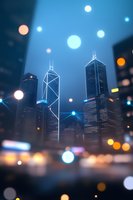 Modern cityscape with illuminated skyscrapers against dark blue sky, featuring glowing bokeh lights and dreamy atmosphere. Artistic urban nighttime photography.