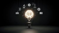 Glowing light bulb with brain inside surrounded by floating education and science icons on dark background representing innovation and learning.