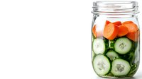 Fresh sliced cucumbers and carrots in glass mason jar on white background, healthy food ingredients for salads and preserving vegetables.