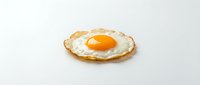 Fried egg with golden yolk on crispy toast, isolated on white background, ready for food and cooking design projects.