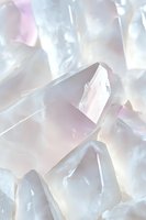 Luminous rose quartz crystals in soft pastel tones create ethereal light effects, showcasing natural mineral formations with delicate pink and white hues for wellness designs.