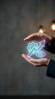 Businessman hands protecting glowing digital icons with gear, growth arrow and target symbols representing business strategy and development concepts.