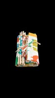 Colorful rolled fabric bundle with striped and patterned textiles, isolated on transparent background. Ready for design use on t-shirts, clipart, stickers, print-on-demand products, and sublimation projects.