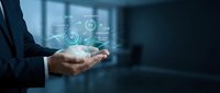 Businessman holding digital holographic interface with glowing icons and data visualization, representing technology, innovation, and business solutions for corporate applications.