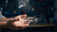 Digital data flows from open palm against blurred urban background, representing technology transfer, innovation, connectivity, and business solutions for corporate communications and tech industry marketing.