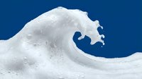 Dramatic white ocean wave crest against deep blue sky background capturing powerful water motion and natural energy in minimalist composition.